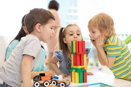 bigstock-Little-Kids-Build-Wooden-Toys--280498753